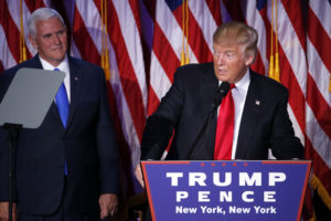 epa05623797 US President-elect Donald Trump (R) speaks next to Vice President-elect Mike Pence (L) as he delivers a speech on stage at his 2016 US presidential Election Night event as votes continue to be counted at the New York Hilton Midtown in New York, New York, USA, 08 November 2016. US businessman Republican Donald Trump has won the US presidential election. Americans voted on Election Day to choose the 45th President of the United States of America to serve from 2017 through 2020. EPA/SHAWN THEW